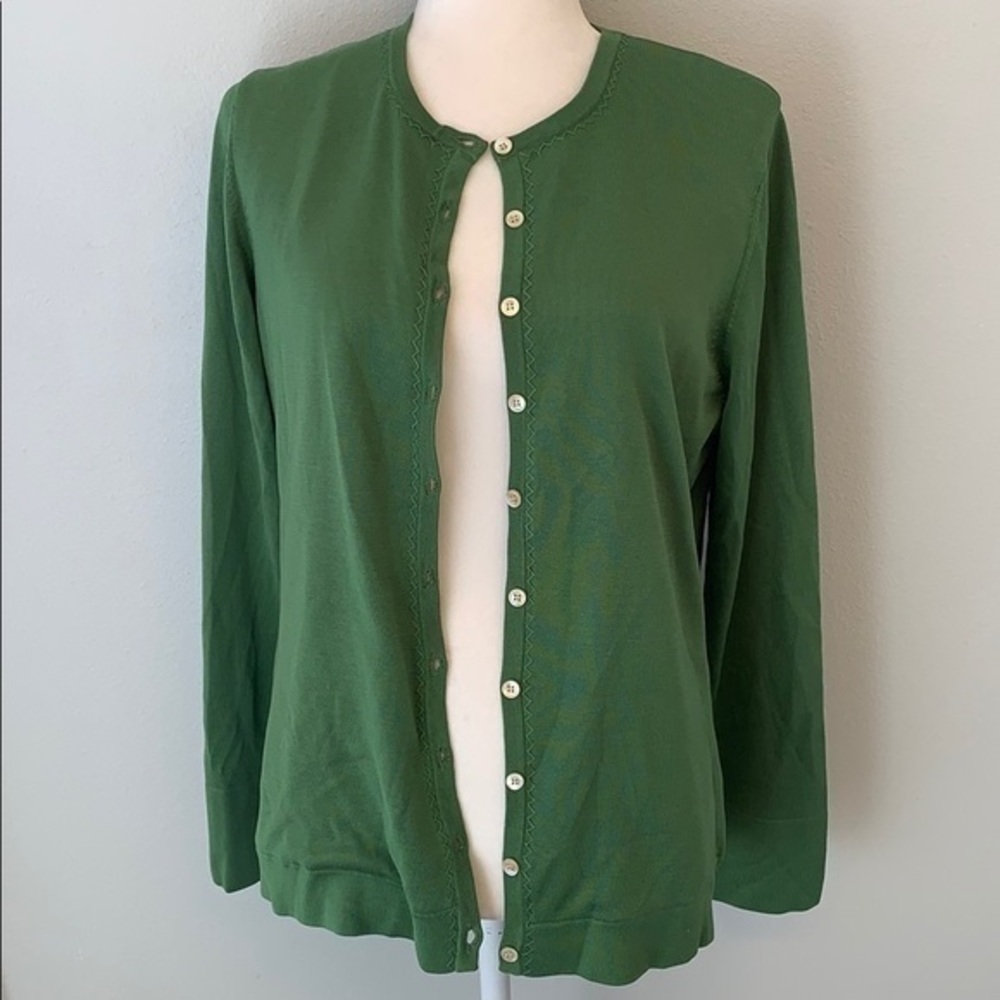 Orvis green button from cardigan sweater.